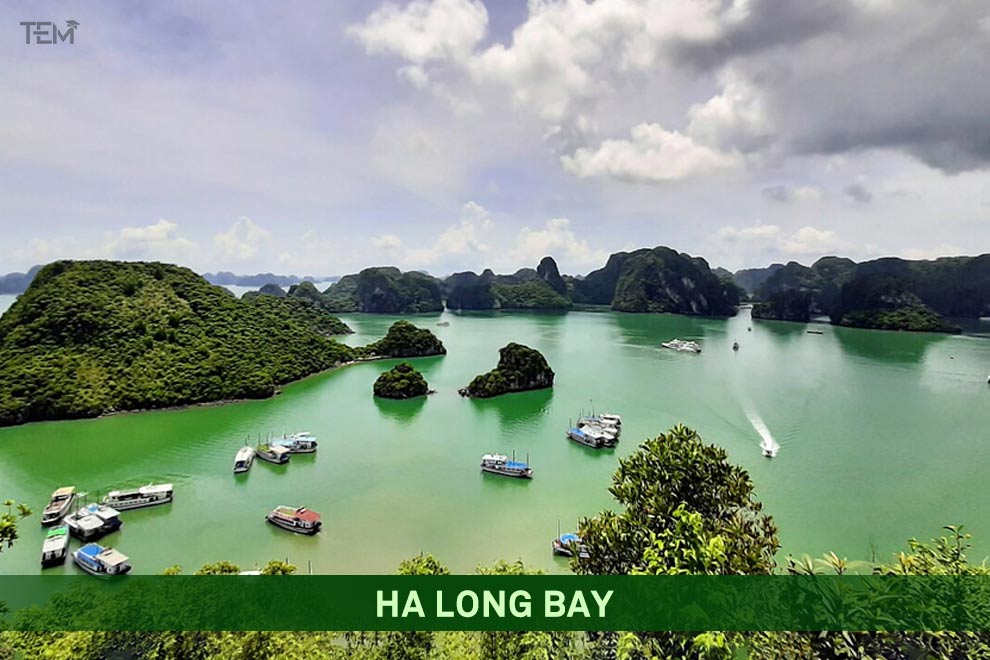 Ha Long Bay in Vietnam featuring emerald waters, limestone karst islands, and cruise boats in a UNESCO World Heritage Site