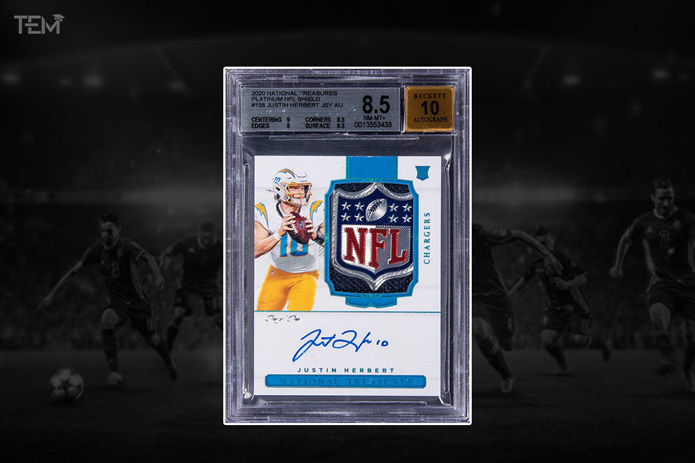 2020 National Treasures Justin Herbert NFL Shield Rookie Patch Autograph 1/1 football card graded Beckett 8.5 with 10 autograph.